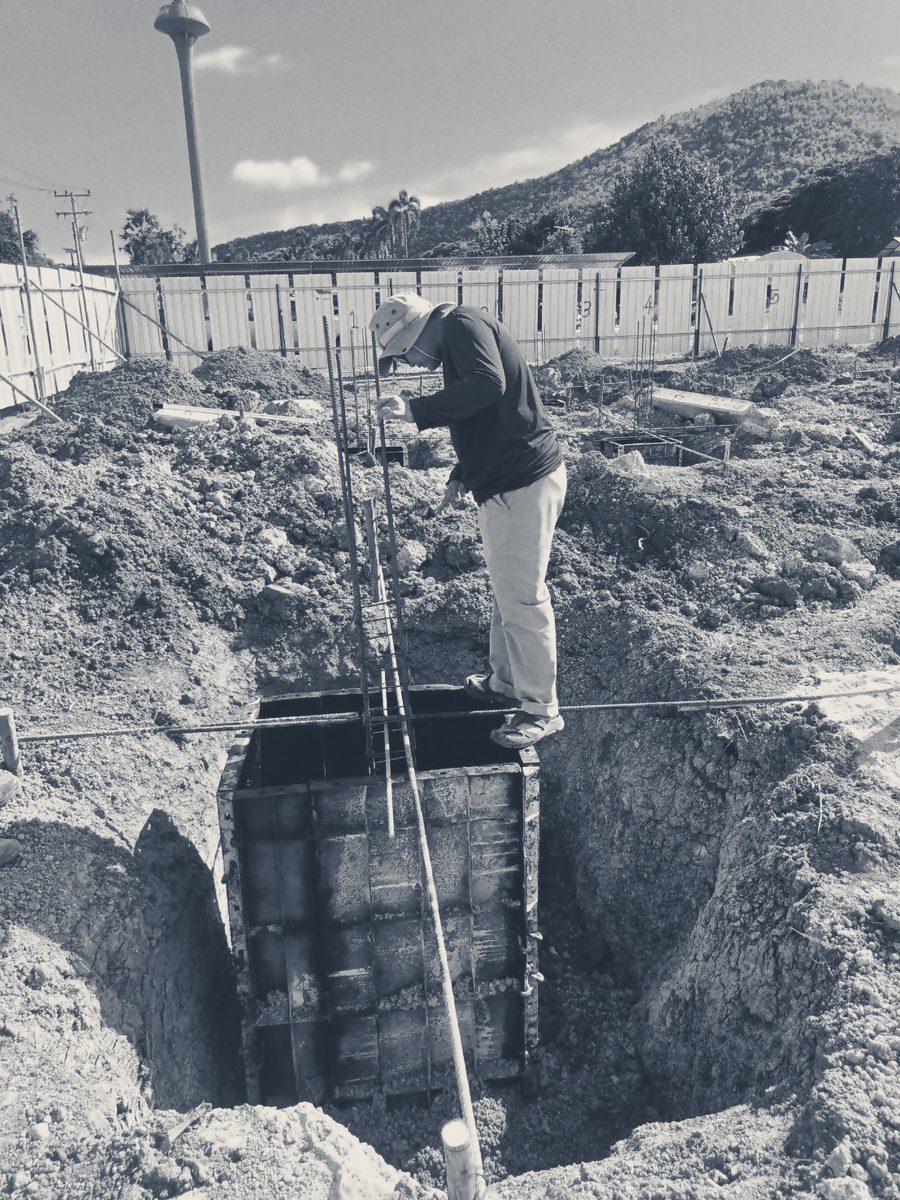 Checking the set-out strings over a footing pit at Reception, seen from above
