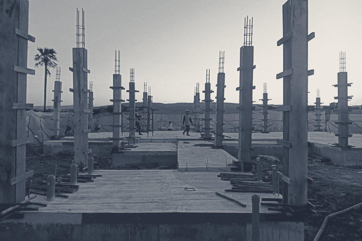 A field of column formwork at dusk