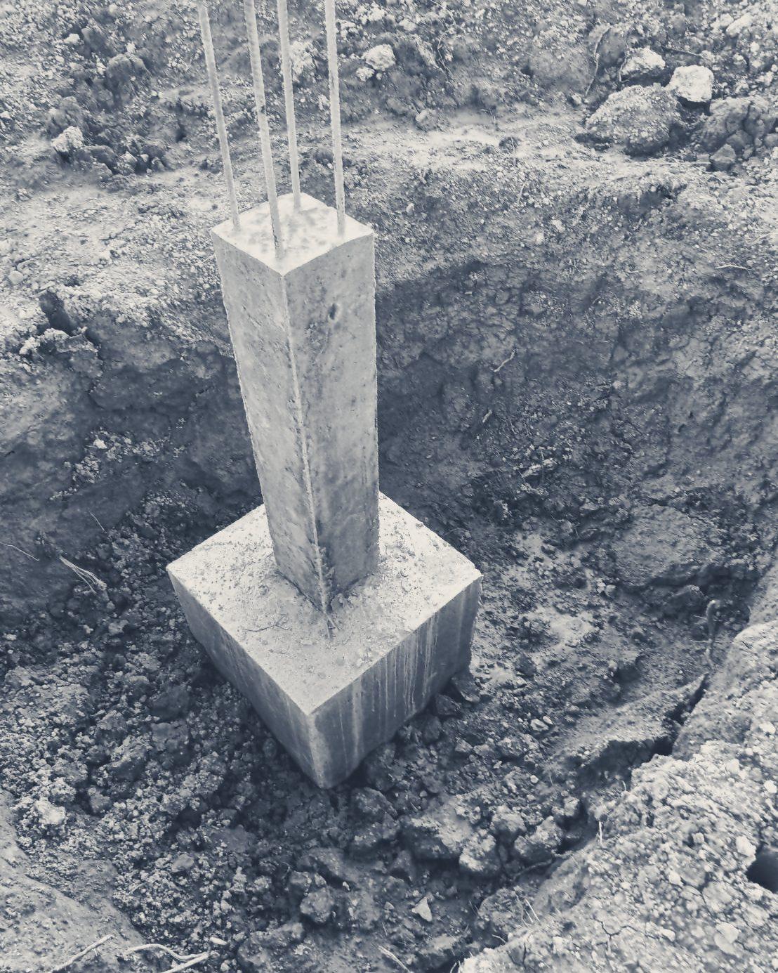 A column stub standing in its footing pit
