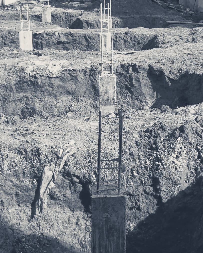 Column stubs standing in a row of footing trenches