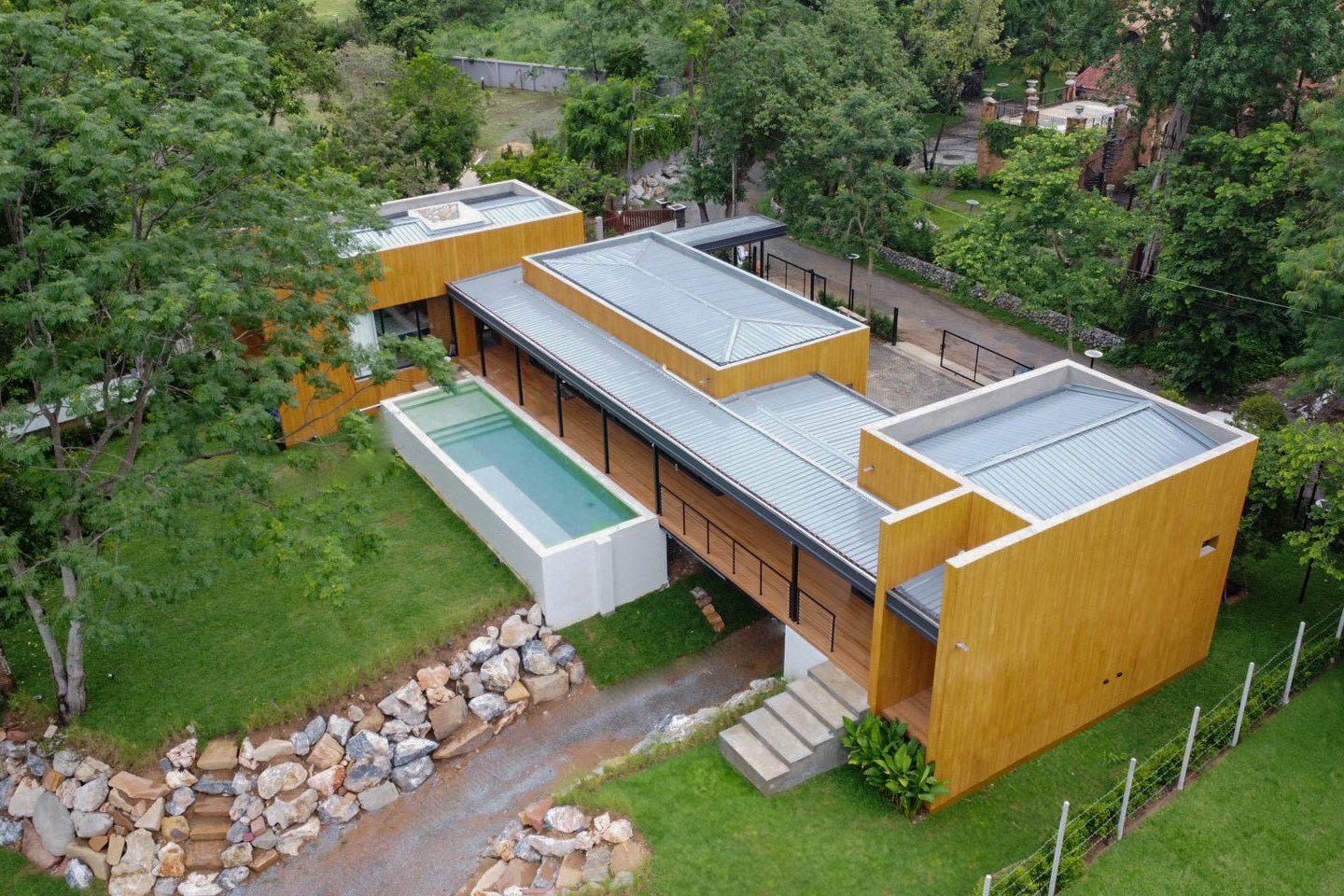 Aerial view of the pool, both wings and the stream bank