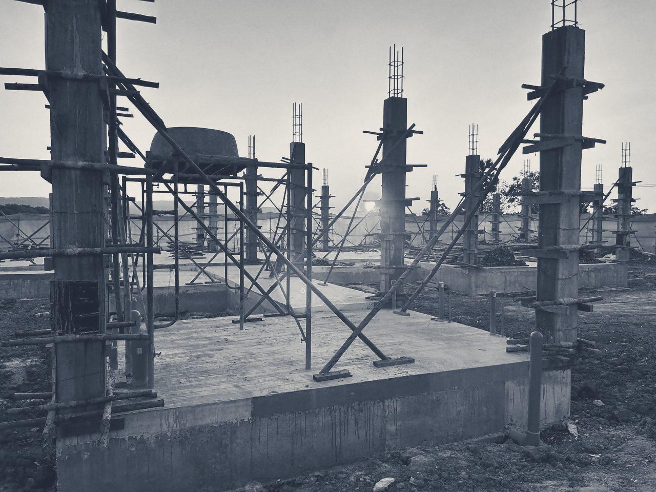 Column formwork and props against a low sun