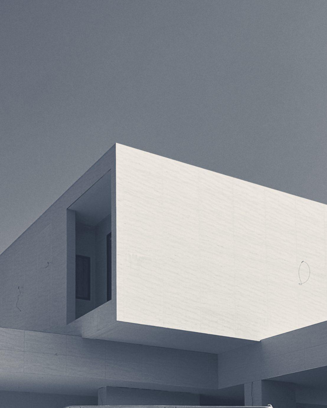 The cantilevered upper room against a clear sky
